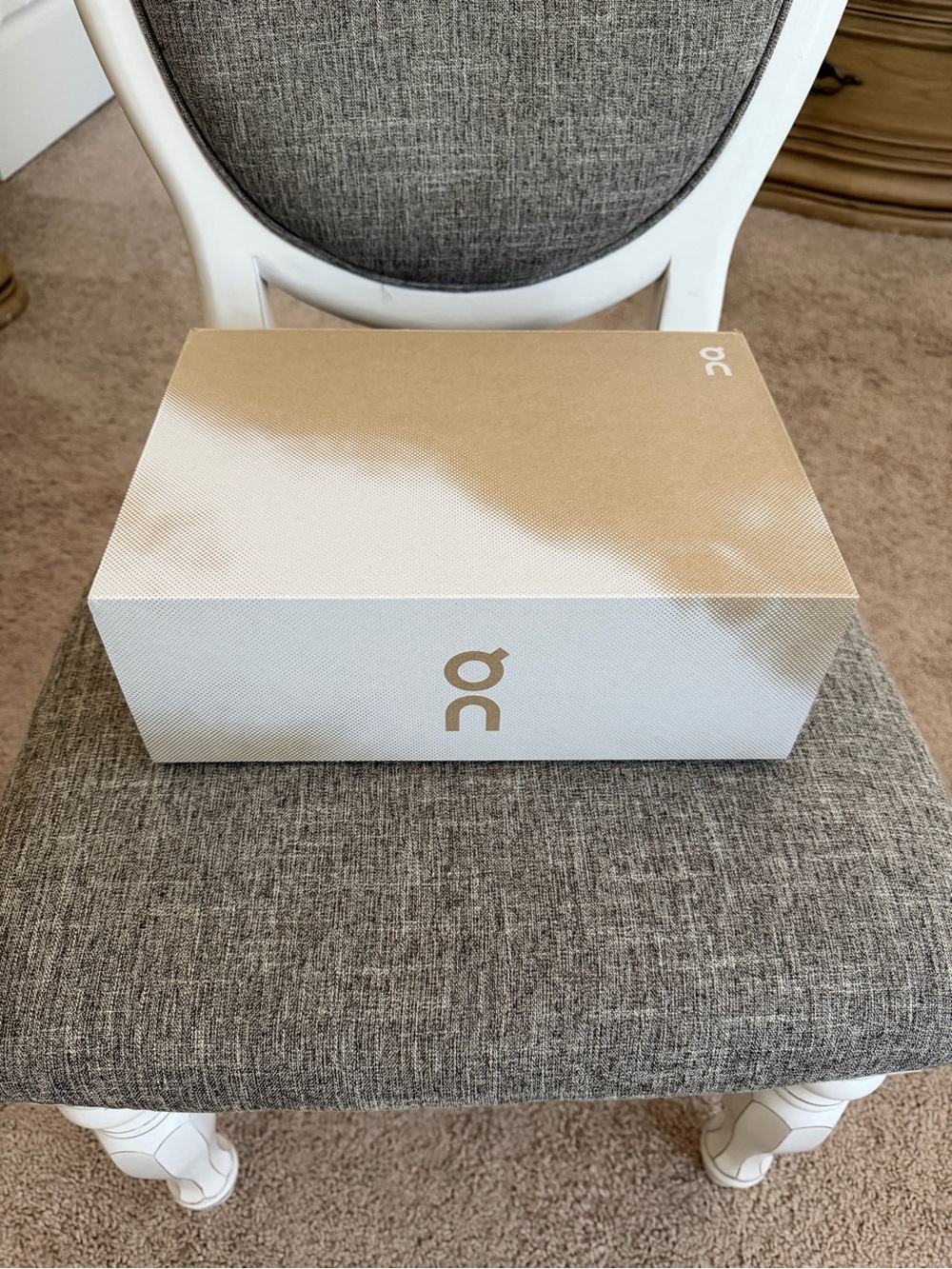 On Running Metallic Gold and White Logo Storage Box